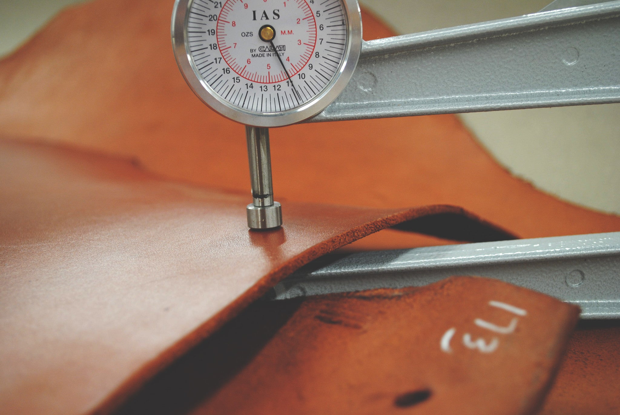 Testing our Veg. Tanned Leather for Consistency with a Leather Gauge